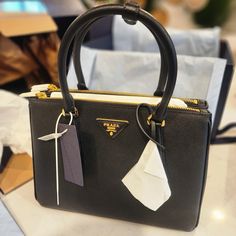 New With Tag (Never Been Used) Come With Everything From The Prada Store Authentic 1000%% Product Code: 1ba863_nzv_f0480_v_eoo Leather Handles Detachable, Adjustable Leather Shoulder Strap. Max. Length: 120 Cm - Min. Length: 110 Cm - Max. Drop Length: 60 Cm - Min. Drop Length: 55 Cm Removable Leather Key Ring External Zipper Pockets Metal Hardware Leather Triangle With Metal Lettering Logo On The Front Snap Closure On The Sides Logo-Print Nylon Lining With Two Pockets, Including One With Zipper Elegant Saffiano Leather Bag With Zipper Closure, Black Saffiano Leather Bag With Zipper, Luxury Saffiano Leather Bag With Zipper Closure, Prada Store, Leather Business Bag, Leather Key Ring, Prada Galleria, Metal Lettering, Prada Tote Bag