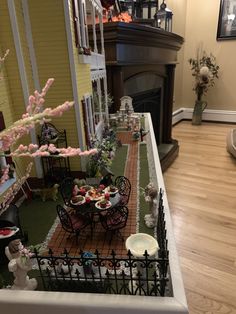 a doll house is set up in the living room