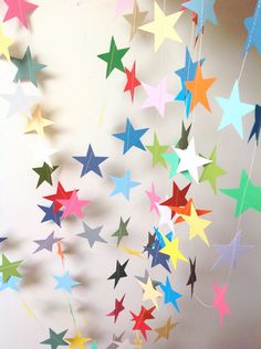 colorful paper stars hanging from the ceiling