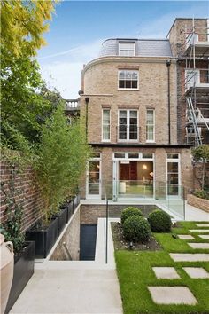 an outdoor courtyard with steps leading up to the building