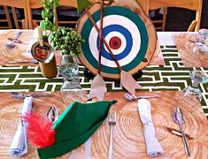 the table is set for an event with paper plates and utensils