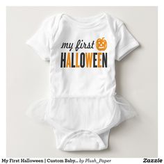 a white baby bodysuit with the words my first halloween written in orange on it