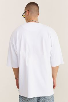 Unleash your artistic side with our white cotton oversized T-shirt, featuring a dynamic paint spots design on the front. This tee is a wearable canvas, blending creativity with comfort. The oversized fit and lowered shoulders create a relaxed, contemporary silhouette that's perfect for casual outings or making a statement. Crafted from soft, breathable cotton, it ensures a comfortable fit for all-day wear. The unique paint spots pattern adds a burst of color and individuality to your wardrobe, m Oversized White Basic T-shirt, Oversized White Drop Shoulder Top, White Oversized Drop Shoulder Top, White Boxy Fit Graphic T-shirt, White Boxy Fit Graphic Tee, White Boxy Fit Drop Shoulder T-shirt, White Relaxed Fit Drop Shoulder T-shirt, Oversized White Tops For Everyday, White T-shirt With Graphic Print And Drop Shoulder