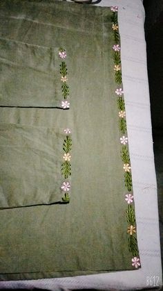 the green fabric has pink flowers on it