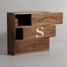 two wooden boxes with the letter s on them