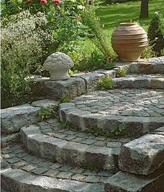 stone steps lead up to an outdoor garden