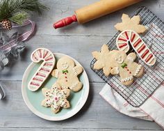 some cookies are sitting on a plate next to baking utensils