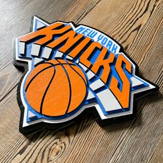 an orange and blue sticker that says new york winks with a basketball on it