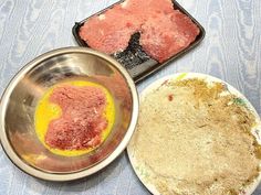 two pans filled with food sitting next to each other on top of a table