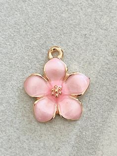 3 dainty pink enamel and gold tone flower charms - pearlized design shiny petals - gold centerListing is for 3 charmsShiny pink enamel flowers Gold tonePearlized shiny petals Daisy flowerNature Flower charmsBouquet Bracelet- necklace - pendant Children’s jewelryPerfect for all your DIY creations Measurement 17mm x 15mm***Although I try hard to represent actual colors, color may vary due to lighting depicted on computer monitors and mobile devices.*** Pink Enamel Jewelry With Flower Charm, Pink Enamel Flower-shaped Jewelry, Gold Jewelry With 3d Petal Flowers, Pink Flower Pendant Jewelry With Charms, Pink Enamel Dainty Jewelry, Pink Enamel Charms Jewelry, Pink Enamel Jewelry With Charms, Pink Dainty Jewelry With Flower Charm, Pink Enamel Charms For Gifts