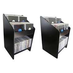 two black shelves with cd's and cds in them