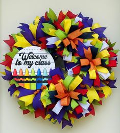 a welcome to my class wreath with colorful streamers on the front and back side