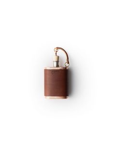 a brown leather flask is hanging on the wall