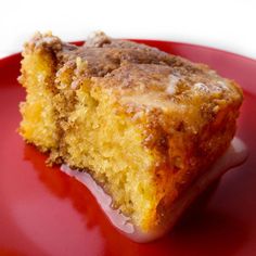 a piece of cake sitting on top of a red plate