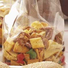 two bags filled with food sitting on top of a table