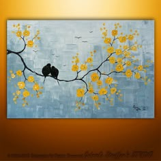 two birds sitting on a branch with yellow flowers painted on the canvas behind them,