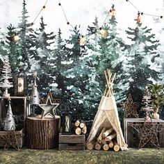 a painting of a teepee tent surrounded by logs and christmas trees with lights strung from them