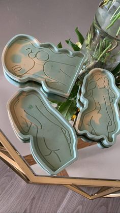 the cookie cutters have been placed on top of each other with flowers in them