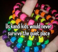 someone is holding their hand in front of the camera and it says, us kandi kids would never survive the quiet place