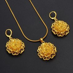 a close up of many pairs of scissors Gold Flower Shaped Jewelry Sets For Wedding, Elegant Gold Plated Filigree Jewelry Sets, Elegant Gold-plated Filigree Jewelry Sets, Gold Flower Pendant Earrings For Wedding, Gold Flower-shaped Earrings For Wedding, Gold Flower Jewelry With Intricate Design, Elegant Filigree Jewelry Sets, Traditional Gold Flower Earrings, Wedding Jewelry With Filigree In Flower Shape