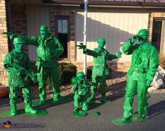 some people are dressed up in green to look like they're going on an army parade