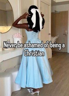 a woman in a blue dress standing next to a mirror with the caption never be shamed of being a christian