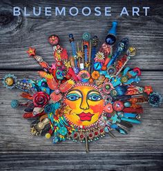 the cover of blue moose art's album, featuring an image of a sun with many