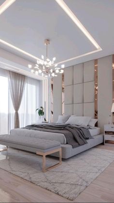 a bedroom with a large bed sitting under a chandelier next to a window