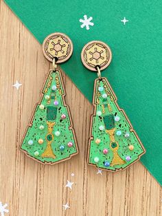 Are you a fan looking for a unique accessory to show off your love for the franchise during the holiday season? Look no further than our hand-painted Destryer ship Christmas tree earrings!  These earrings are not your average holiday accessory - they feature intricate details of iconic ships, making them a great conversation starter at any festive gathering. And don't worry about finding the perfect gift for that special someone.  These earrings make an excellent Christmas gift for any  enthusia Resin Christmas Tree Earrings, Princess Earrings, Christmas Tree Star, Christmas Tree Earrings, Star Destroyer, Earring Tree, Accessories Unique, Holiday Season, Favorite Jewelry