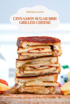 grilled cheese sandwich stacked on top of each other with apple slices in the background