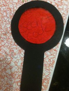 a black and red object with writing on it