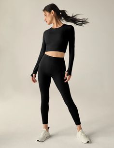 Introducing the Beyond Yoga PowerBeyond Lite Airshield Long Sleeve Cropped Top, a lightweight and fitted long-sleeve top designed for high-performance activities like running, biking, hiking, and beyond. This top offers a sleek silhouette with functional features to keep you comfortable and stylish during your workouts. Key Attributes: Crew Neckline: The classic crew neckline offers a comfortable fit and a streamlined look, perfect for layering or wearing on its own. Princess Seams & Panels: Fro Long Sleeve Top Design, Shorts And Leggings, Long Sleeve Cropped Top, Black Long Sleeve Crop Top, Layered Long Sleeve, Yoga Set, Beyond Yoga, Princess Seams, Princess Seam