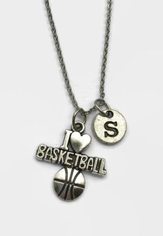 "This basketball necklace is the perfect accessory for anyone who loves playing basketball or watching basketball. It is a stylish necklace that can be worn with just about anything. 17.8\" long stainless steel cross-link necklace Charms are made from a zinc alloy metal which is lead and nickel free. Each purchase will arrive packaged in a cute kraft gift box ready to give as a present or a fun gift for yourself! Add on a birthstone charm for $3.00 Additional initial charm $3.50 *Go back to OurL Basketball Bf Gifts, Basketball Lovers Gift Ideas, Christmas Gifts For Basketball Boyfriend, Basketball Presents, Cute Basketball Necklace, Basketball Jewelry, Basketball Necklace, Friendship Knot, Love Basketball