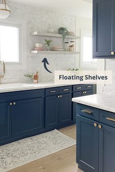 a kitchen with blue cabinets and white counter tops that says floating shelves above the sink