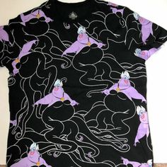 a black shirt with purple horses on it