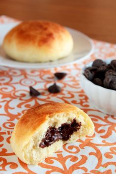 two plates filled with cookies and raisins next to a bowl of raisins