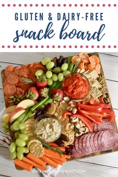 a platter filled with meats, vegetables and crackers for a gluten and dairy - free snack board