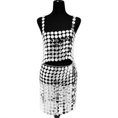 Title: Handmade Glitter Mirror Sequins Patchwork Strappy Nightclub Split SkirtDescription:Make a stunning entrance with our Handmade Glitter Mirror Sequins Patchwork Strappy Nightclub Split Skirt. This eye-catching skirt is meticulously crafted with high-quality alloy and silver-plated sequins. creating a dazzling and fashionable piece.Product Details:MATERIAL: Crafted with care. this skirt is made of high-quality alloy and features silver-plated sequins. ensuring durability and a luxurious shine.SPECIAL DESIGN: The unique structure and design of this skirt make it a must-have item for those who want to stand out and make a bold fashion statement. The combination of glitter mirror sequins and strappy details adds a touch of allure and elegance.FASHIONAL STYLES: Embrace the latest trends wi Glamorous Metallic Summer Skirt, Metallic Sequin Mini Skirt For Summer, Summer Silver Sequined Mini Skirt, Metallic Mini Skirt For Summer Club, Summer Metallic Sequin Skirt, Summer Club Metallic Mini Skirt, Metallic Disco Mini Skirt For Summer, Sequin Disco Mini Skirt For Club, Metallic Sequin Skirt For Night Out