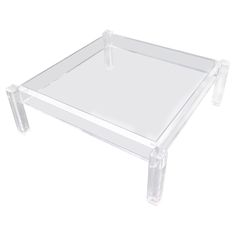 a clear plastic coffee table with two legs