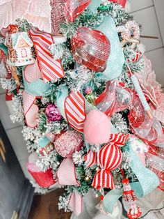 a christmas tree decorated with red, white and blue ornaments