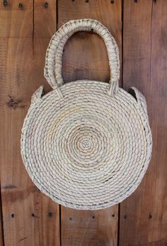 Lightweight Bag. Large Bag. Hand died palm leaf. Round Handel. Beach Bag. TASSEL SOLD SEPARATELY Diameter- 10 inches Height including handals- 15 inches Bohemian Natural Beach Bag For Everyday Use, Bohemian Natural Beach Bag, Bohemian Style Natural Beach Bag, Bohemian Beach Bag In Natural Color For Daily Use, Bohemian Straw Bag With Braided Handles For Festival, Bohemian Beach Bag With Braided Handles, Bohemian Straw Bag For Vacation, Bohemian Fair Trade Straw Bag For Beach, Bohemian Handwoven Beach Bag For Festivals