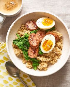 a bowl filled with rice, eggs and sausage