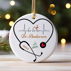 a christmas ornament with a stethoscope in the shape of a heart