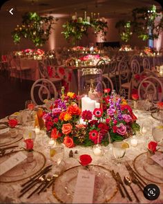 the table is set with flowers and candles for an elegant wedding reception at the four seasons hotel