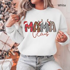 Get ready to spread the holiday cheer with our Mama Claus Family Matching Christmas Sweatshirt! Perfect for family gatherings, this cozy sweatshirt is designed to keep you warm and stylish as you celebrate the festive season. Crafted with care, this  Xmas shirt features a playful and heartwarming design that embraces the spirit of Santa Claus and family traditions. Whether you're decorating the tree or enjoying a cozy evening at home, this fun Xmas shirt will keep you looking festive and feeling Family Matching Christmas, Cozy Evening, Xmas Shirts, Sweatshirt Cute, Holiday Shirt, Cozy Sweatshirts, Holiday Shirts, Family Traditions, Shirt For Women