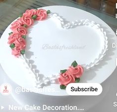 a heart shaped cake with pink roses on top and the words subscribe above it