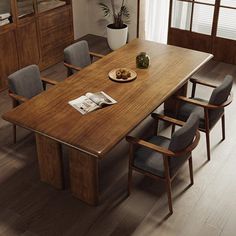 a dining room table with chairs around it