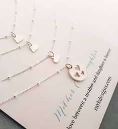 Mother and three daughters shareable necklace set. sterling silver cut out three heart disc for mother and tiny heart charm for daughters. sterling silver satellite chain. small heart charm necklace-16-18'' Cutout heart charm necklace-16-18'' *Please let me know if you need diff. length. I do not charge extra up to 20'' sterling silver cutout heart disc-13mm sterling silver tiny heart charm-7mm You can find more options for Mother daughter jewelry~ https://www.etsy.com/shop/thejewelrybar?section Mother And Three Daughters, Birthday Gift Mom, Mother Daughter Jewelry, Heart Disc, Mom Of 3, Adoption Gifts, Daughter Jewelry, Three Daughters, Daughter Necklace