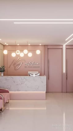 a pink reception area with marble counter tops