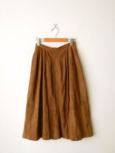 "Vintage Camel Brown Soft Suede A-line Midi Skirt from 70's. Measurements Length          : 30 1/2\" Waist             : 24\" Hips               : 44\" Condition     : Gently used. There's few stains as shown in the last three pics.  ※Please read the policy before you purchase※" Brown A-line Skirt For Spring, Spring Brown A-line Skirt, Fall Full Length Brown Maxi Skirt, Brown Full-length Maxi Skirt For Fall, Brown Full Length Maxi Skirt For Fall, Brown Full-length Skirt For Spring, Brown Full Length Skirt For Spring, Spring Full Length Brown Skirt, Fitted A-line Brown Maxi Skirt